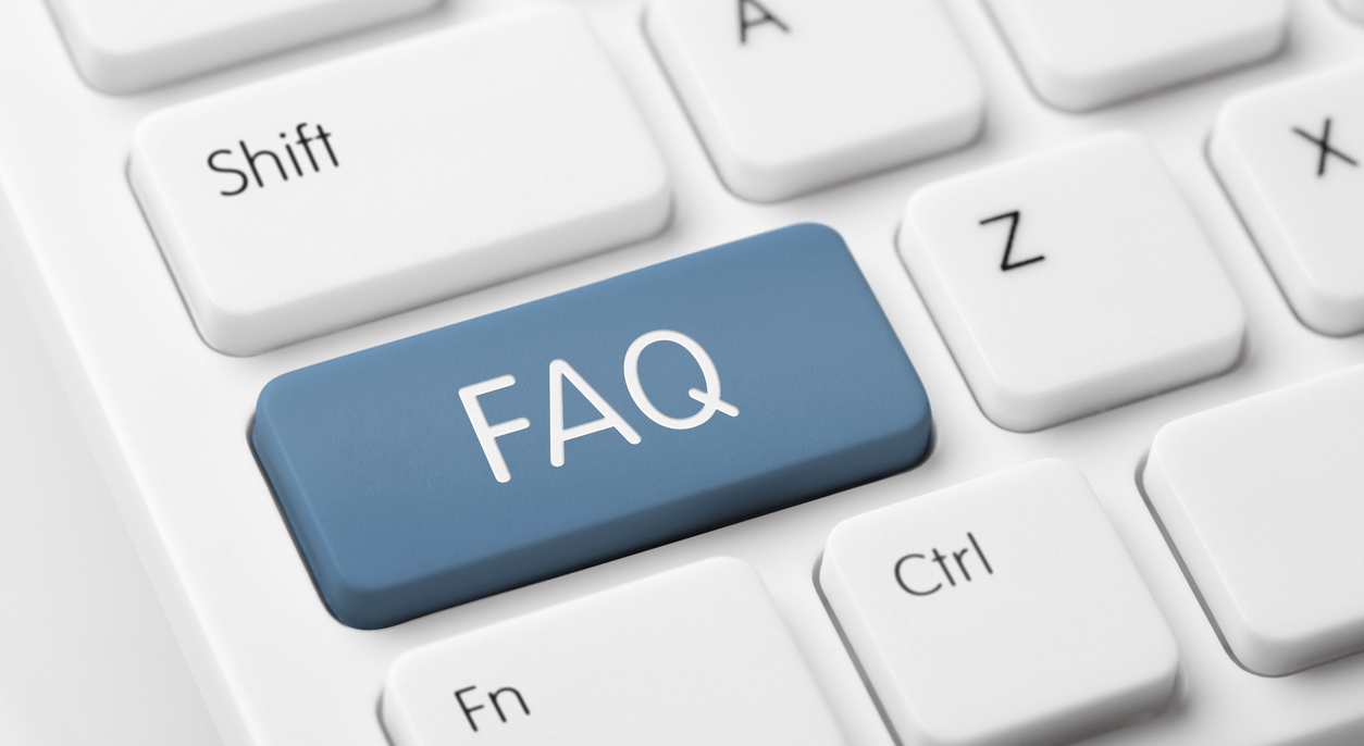 white keyboard with key that reads FAQ (frequently asked questions).